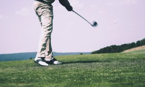Golf player swings