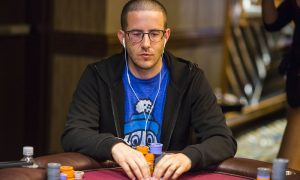 Greg Merson poker player at table