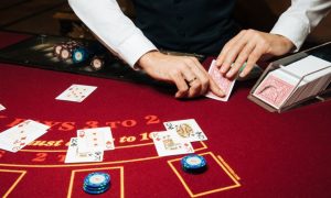 Bright Red Blackjack Table and Casino Dealer
