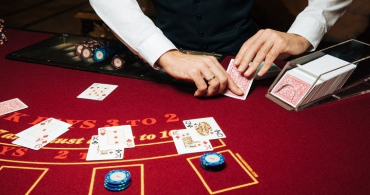 Bright Red Blackjack Table and Casino Dealer