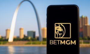 BetMGM Sportsbook app displayed on a smartphone with the St. Louis Arch in the background.