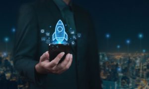 Digitized Rendering of a Rocket Rises From Cell Phone In Man's Hand