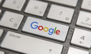 Computer Keyboard Has Google Logo On Enter Button
