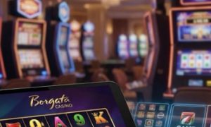 Borgata Bonus Code overlaid on a professional mobile casino background featuring slot machines, a blackjack table, and a person dealing cards.