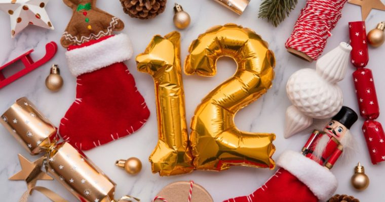 Christmas Decorations Displayed On Table with Number 12 Gold Balloon at Center