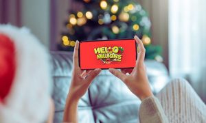 Woman Plays HelloMillions on Cell Phone with Christmas Tree Background