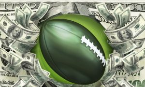 Green American Football Surrounded By Cash Bills with $100 Bill Background