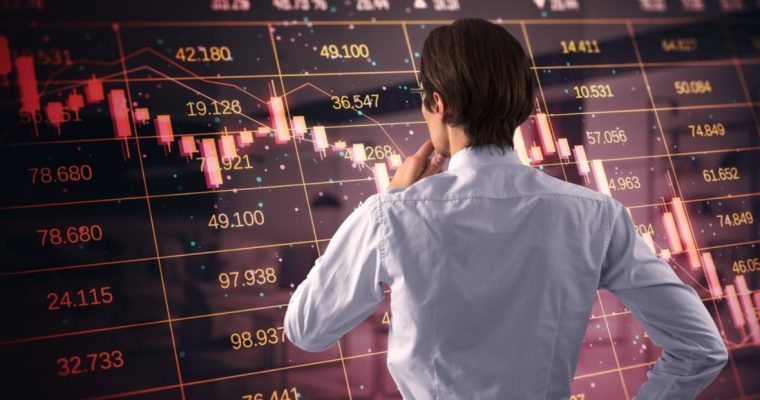 Man Thinks While Facing Oversized Financial Stock Graph