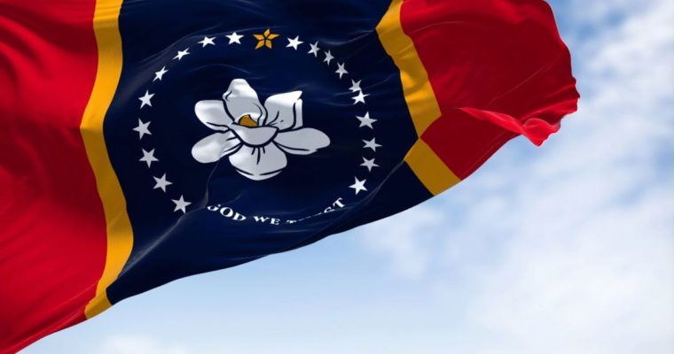 The state flag of Mississippi is waving in the wind.