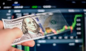 Prediction Financial Graph Background to Hand Holding Fading $100 Bill