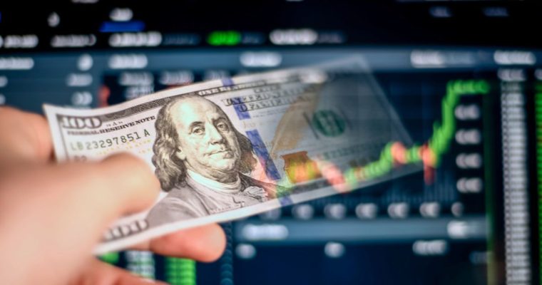Prediction Financial Graph Background to Hand Holding Fading $100 Bill