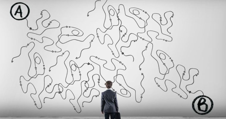 Messy Black Lines Spread Out Across White Background As Man In Suit Stares