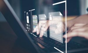 Person Typing on Laptop With Digital Overlay Concept of Identity
