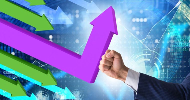 Fist Wearing Business Suit Changes Direction of Purple Downward Trending Arrow