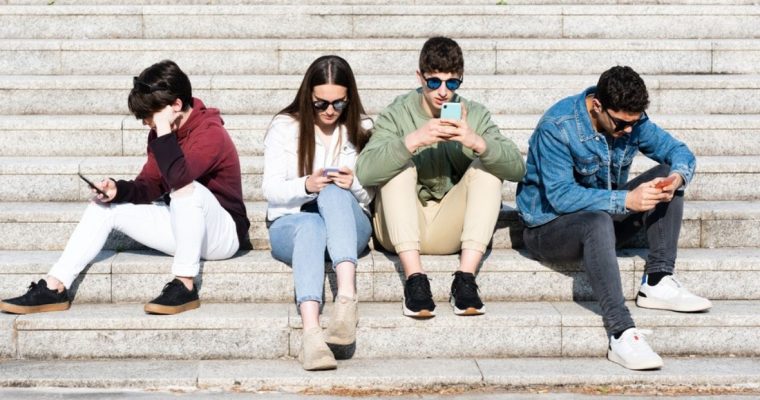Young Minds Stare at Cell Phones Hooked on Dompamine-Enducing Short-Term Rewards