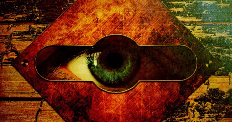 Green Eye Peers Through Square Shaped Keyhole on Wooden Door