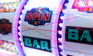 Colorful Slot Reels Display Bar and Spin Symbols with Diamonds Lining Separation