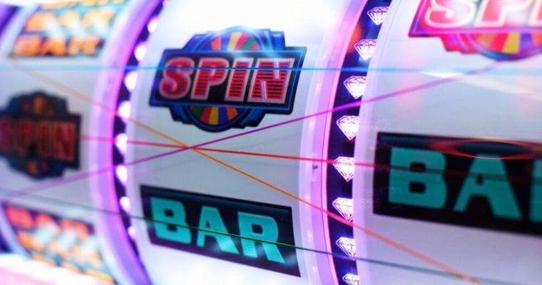 Colorful Slot Reels Display Bar and Spin Symbols with Diamonds Lining Separation
