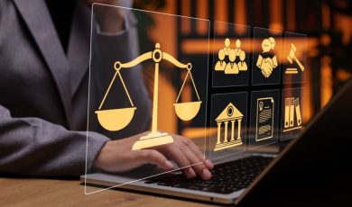 Person in Suit Uses Laptop And Digital Icons Overlay Displaying Legal Concept