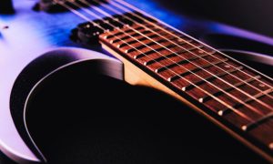 Close Up Of Wires on Purple Electric Guitar