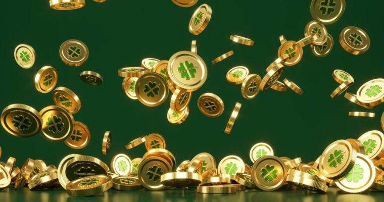 Four Leaf Clovers Design on Gold Coins Falling on Table