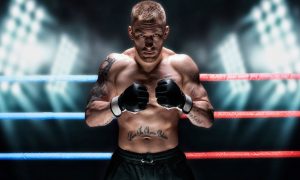 UFC Fighter Poses With Fists To Chest Inside Ring