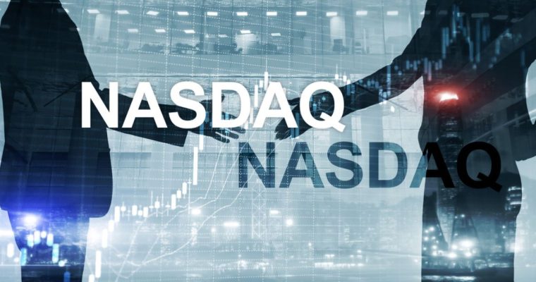 Two People In Suits Stretch Hands Ready for Shake with NASDAQ Text Overlay