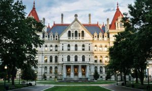Green Grass and Trees Line the Front of the Capitol Building in Albany, New York