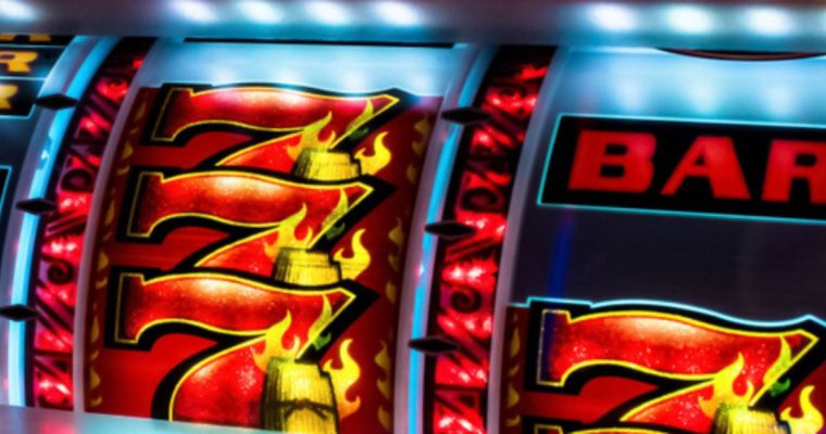 Close Up of Slot Machine Reel with Triple 7's and Bar Symbol