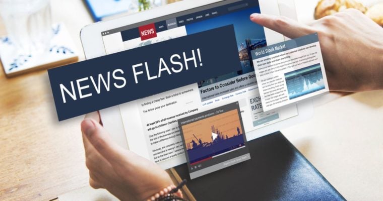 Man Holds iPad with News Flash! Text Box and News Articles Displayed
