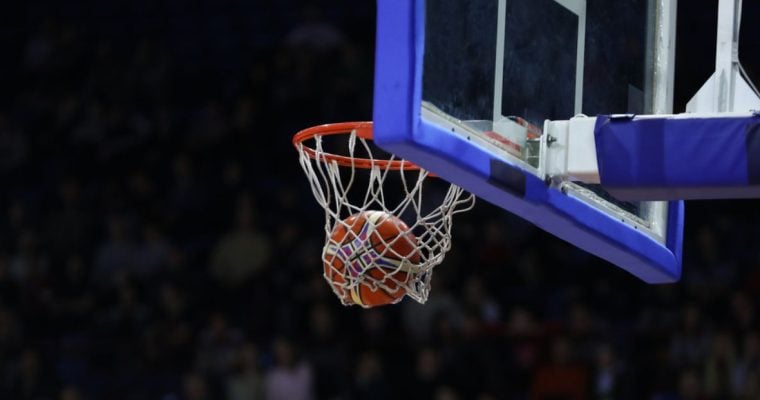 Blue Lined Backboard with Basketball Netting Hoop Inside Game Stadium