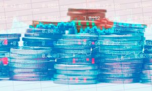 Financial Line and Candlestick Graphs Overlay Image of Stacked Coins on Grid Background