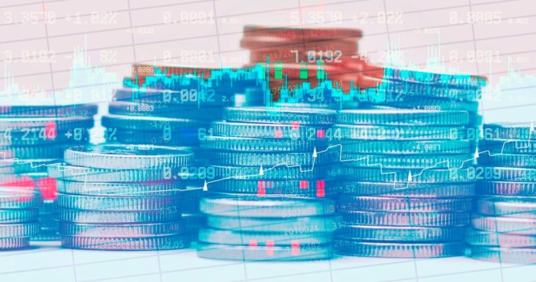 Financial Line and Candlestick Graphs Overlay Image of Stacked Coins on Grid Background