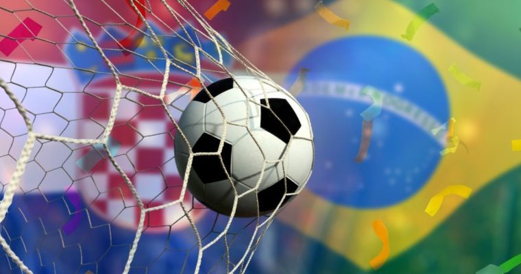 Soccer Ball Hits Back of Net with Flags of Brazil and Croatia in Background