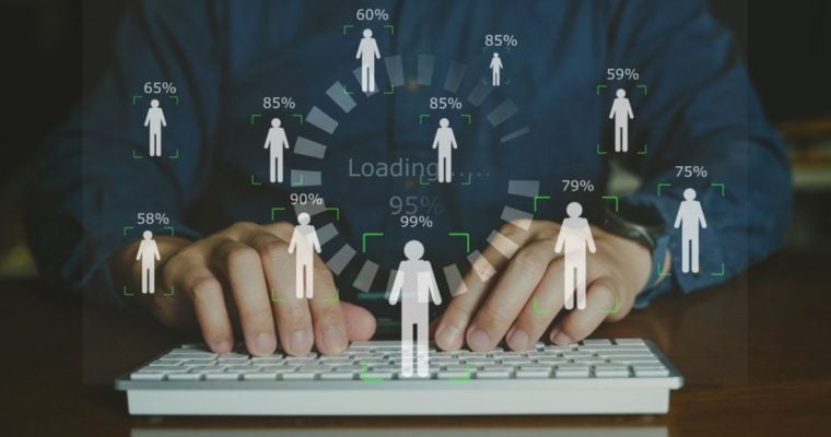 Man Using Laptop Background to Digital Overlay of Human Figures With Percentages Above Heads