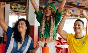 Three Friends Celebrating and Socializing in a Vibrant Outdoor Atmosphere
