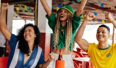 Three Friends Celebrating and Socializing in a Vibrant Outdoor Atmosphere
