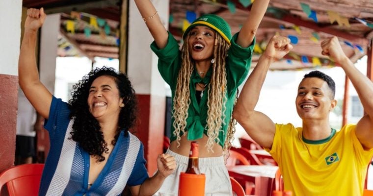 Three Friends Celebrating and Socializing in a Vibrant Outdoor Atmosphere