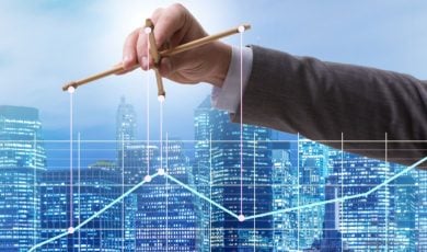 Blue Cityscape Background With Man in Suit Holding Puppet Sticks Over Line Graph