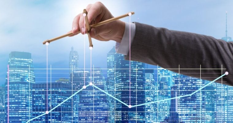 Blue Cityscape Background With Man in Suit Holding Puppet Sticks Over Line Graph