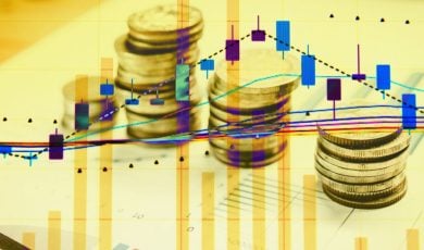 Coins Stacked On Papers with Colorful Candlestick Graph Overlay and Gold Overtone on Entire Image