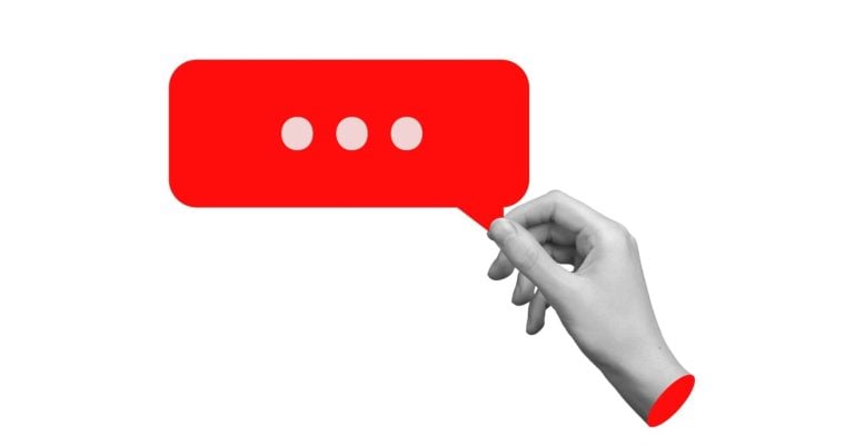 Art Collage of Isolated Black-White Hand Holding a Red Speech Bubble