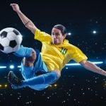 Athletic Football Player Kicking a Soccer Ball Mid Air on Black Background