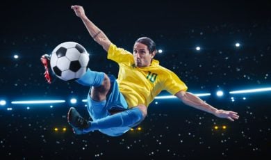 Athletic Football Player Kicking a Soccer Ball Mid Air on Black Background