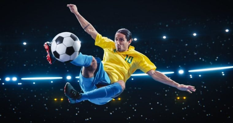 Athletic Football Player Kicking a Soccer Ball Mid Air on Black Background