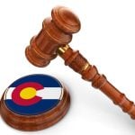 Colorado Flag Printed on Base of Judge's Wooden Mallet With Gavel Hovering Above