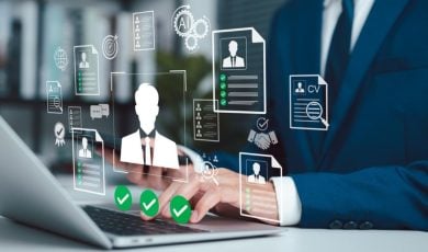 Man in Suit Sits At Desk Must Pass Identification Checks While Using Laptop