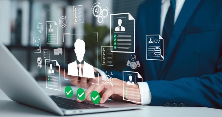 Man in Suit Sits At Desk Must Pass Identification Checks While Using Laptop