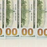 U.S. Banknotes Layed Out Over Each Other To Read as 1 Billion