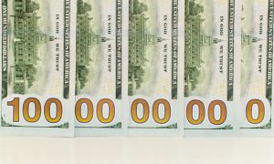 U.S. Banknotes Layed Out Over Each Other To Read as 1 Billion